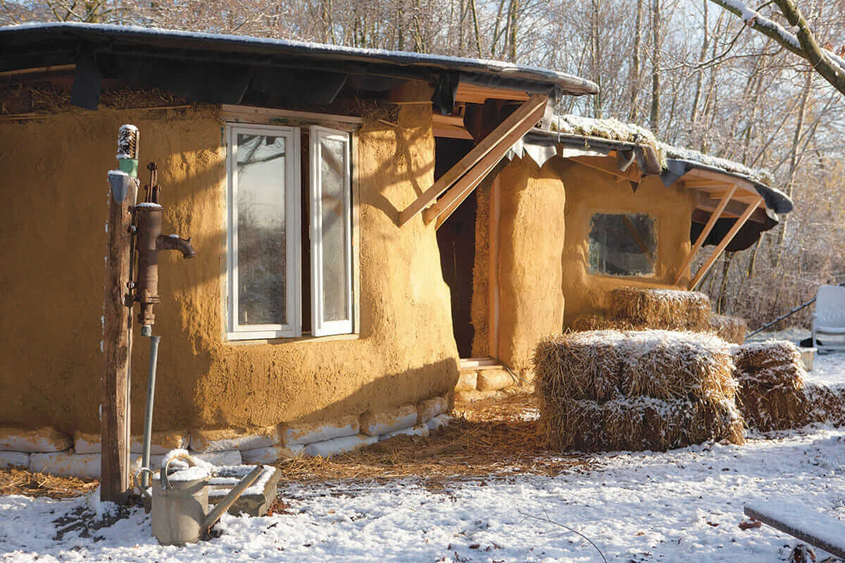 The final product is super-insulated, and relies on solar power. They've also built a zero-energy refrigeration unit using a pipe that runs through the cool soil beneath the house.