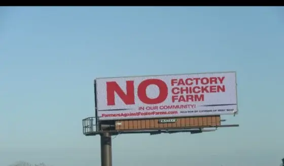 A billboard against factory farming.